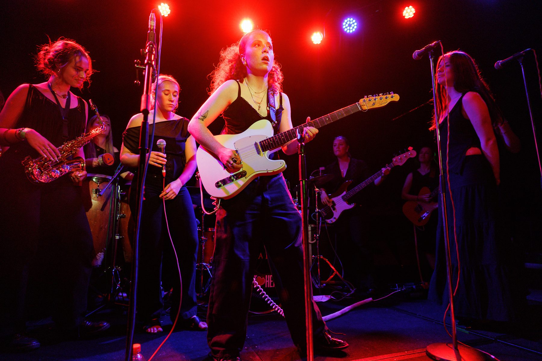 Sweethearts band guitarist performing live on stage